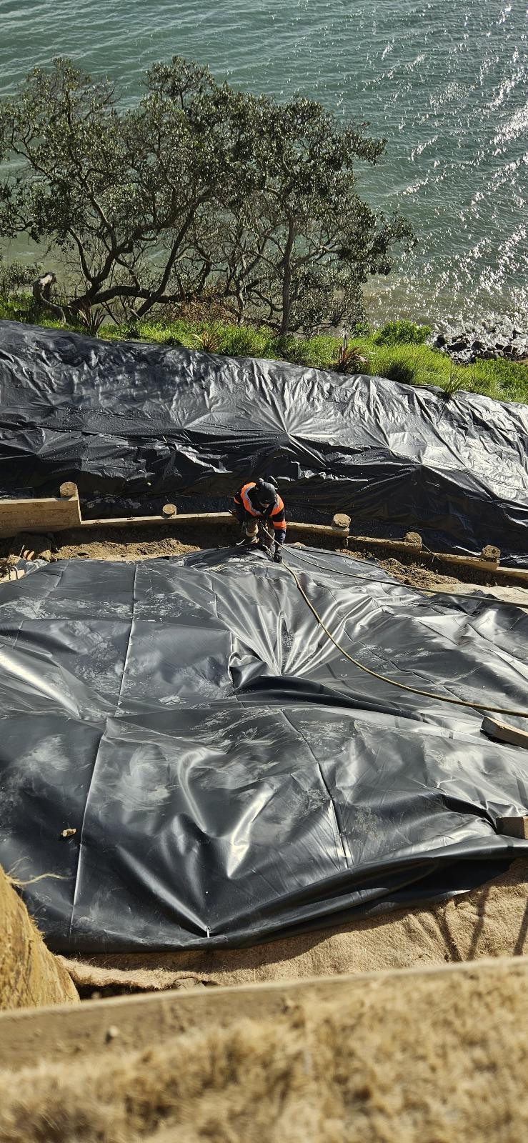 Emergency polythene covering installed on slip face